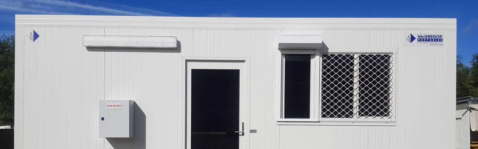 White portable building with McGregor signage